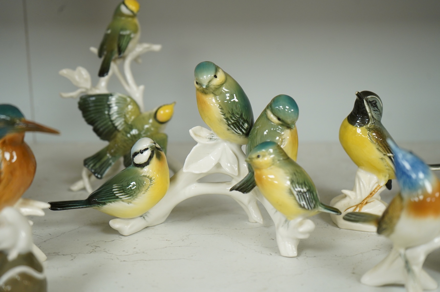 A collection of Copenhagen and other German porcelain birds, tallest 20cm